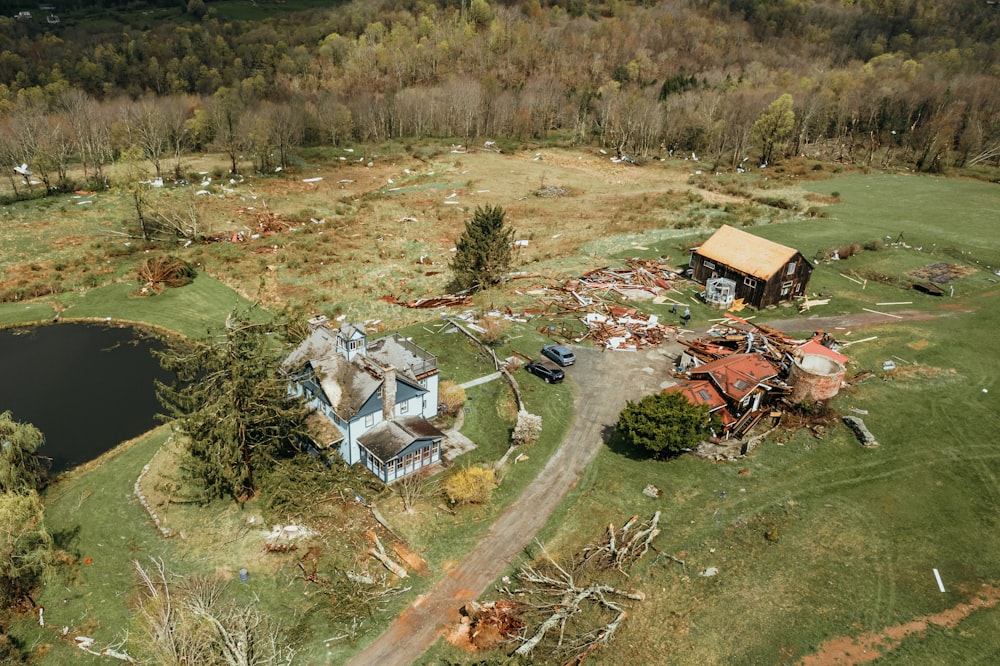 an aerial view of a house in the middle of a field