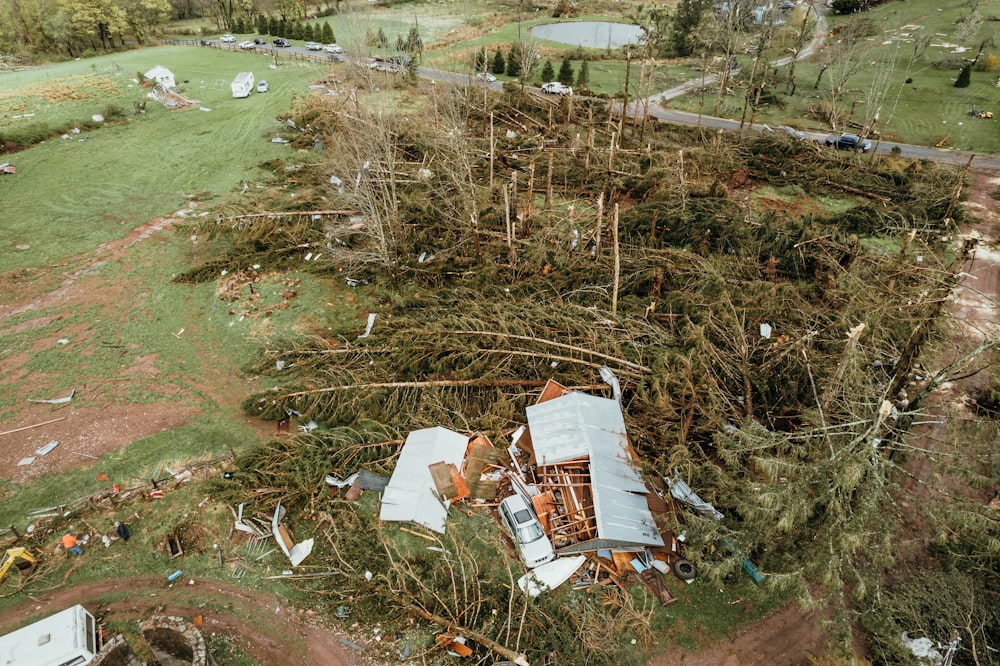 a house that has been torn down in the middle of a field