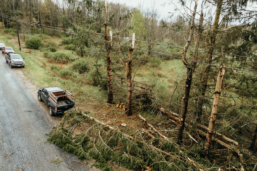 a couple of cars parked on the side of a road