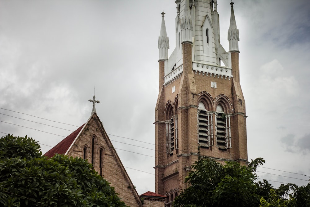 a church steeple with a clock on it