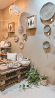 A cozy corner showcasing a blend of natural textures: woven baskets, soft throws, and a charcoal accent wall.