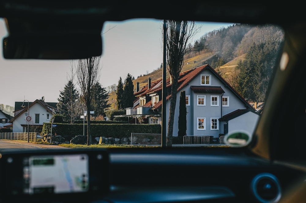 a view of a house from inside a car
