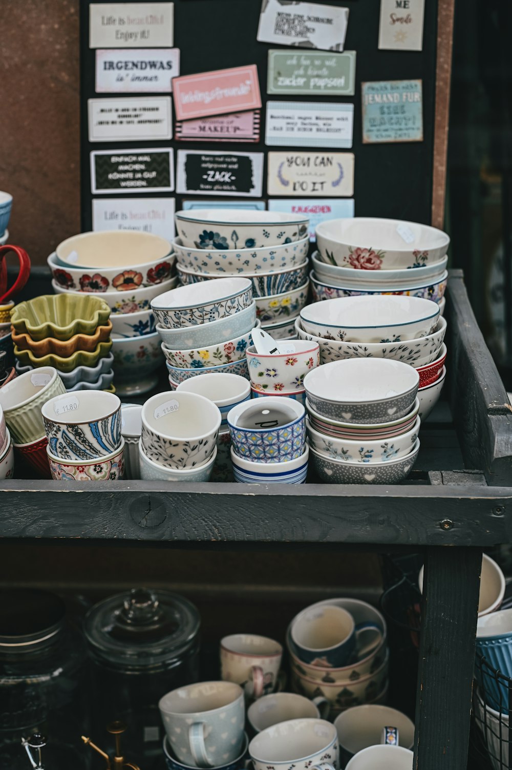 a table topped with lots of cups and bowls