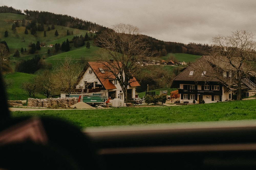 a house in the middle of a green field