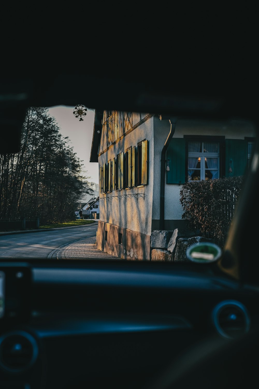 a view of a house from inside a car