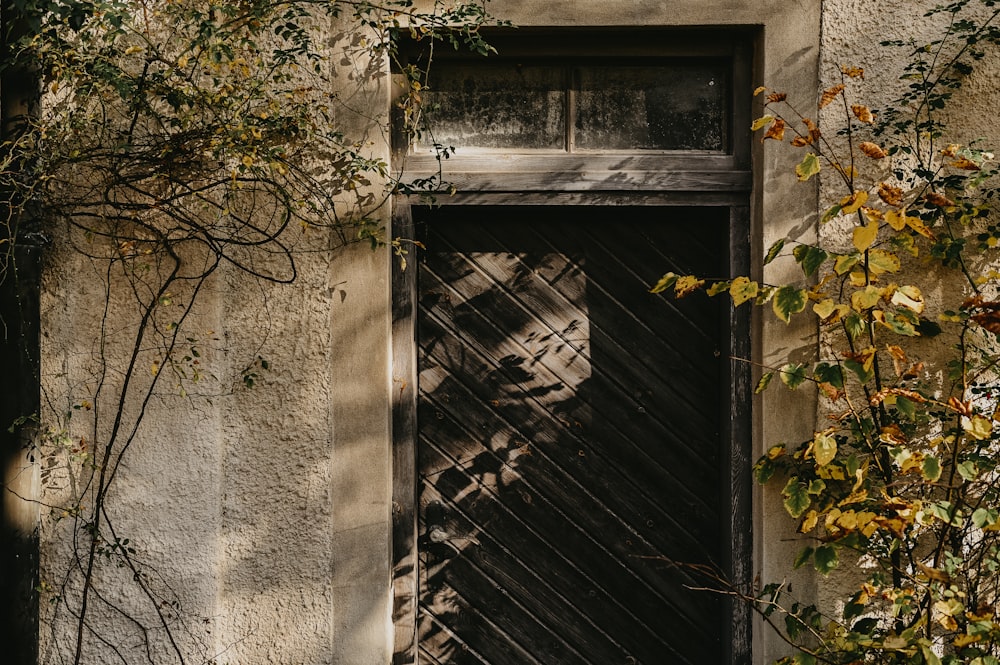 an old building with a wooden door and a window