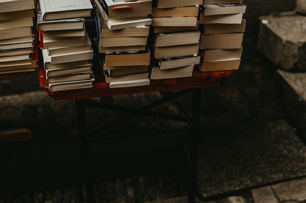 a stack of books sitting on top of a table