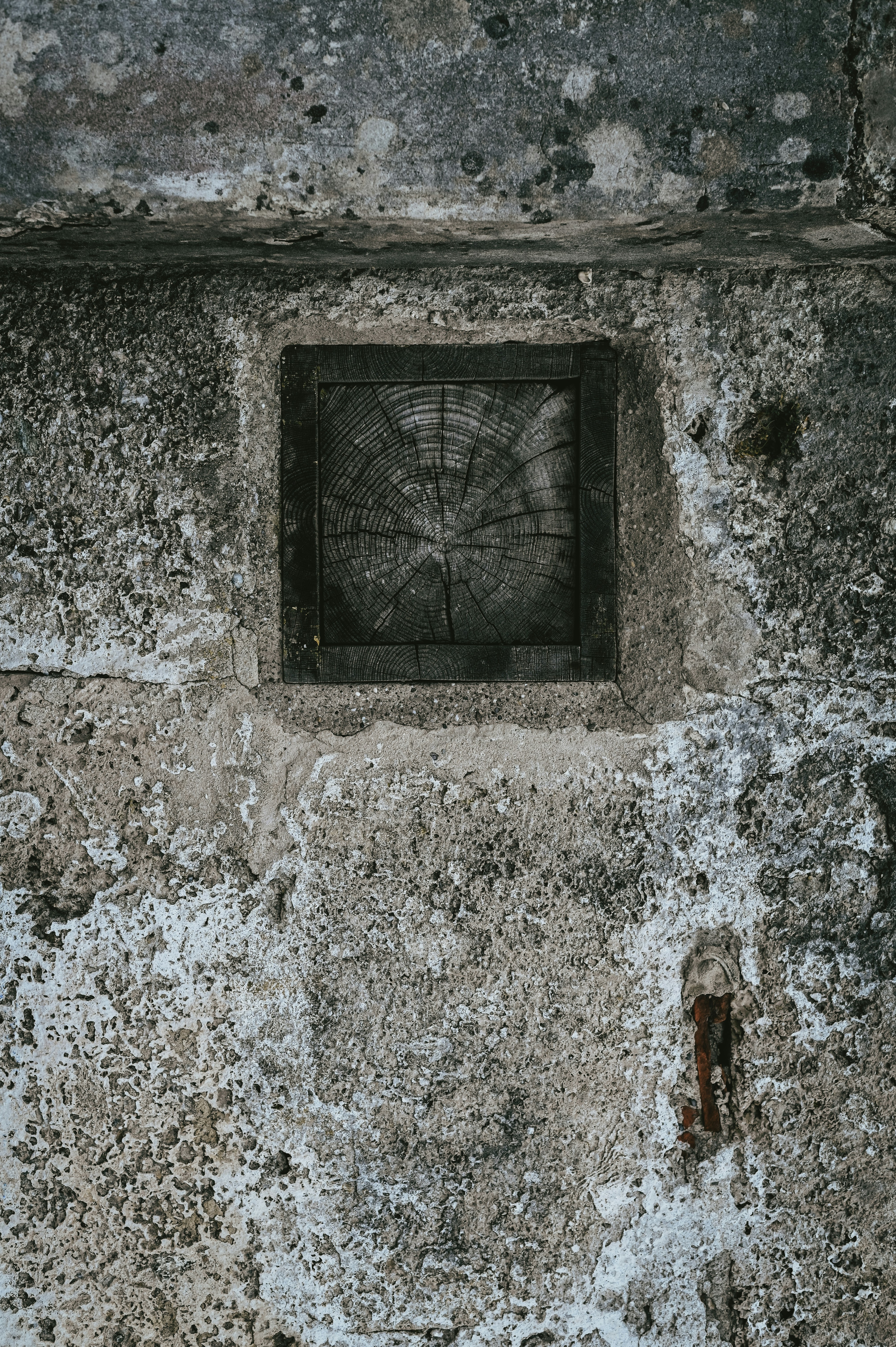 a square window in a stone wall