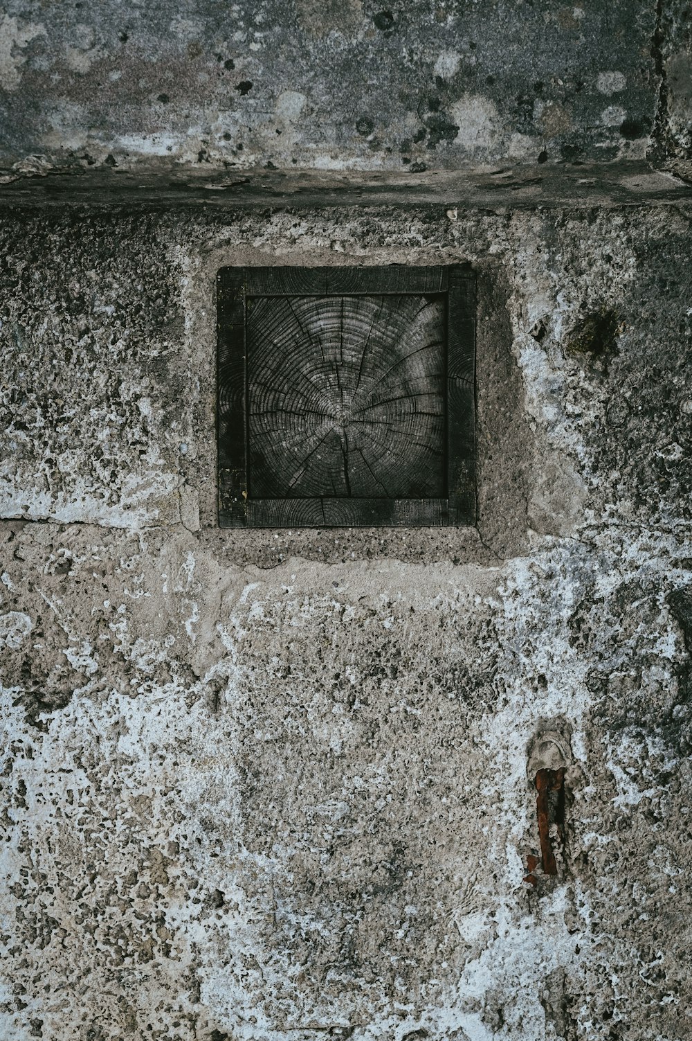 a square window in a stone wall