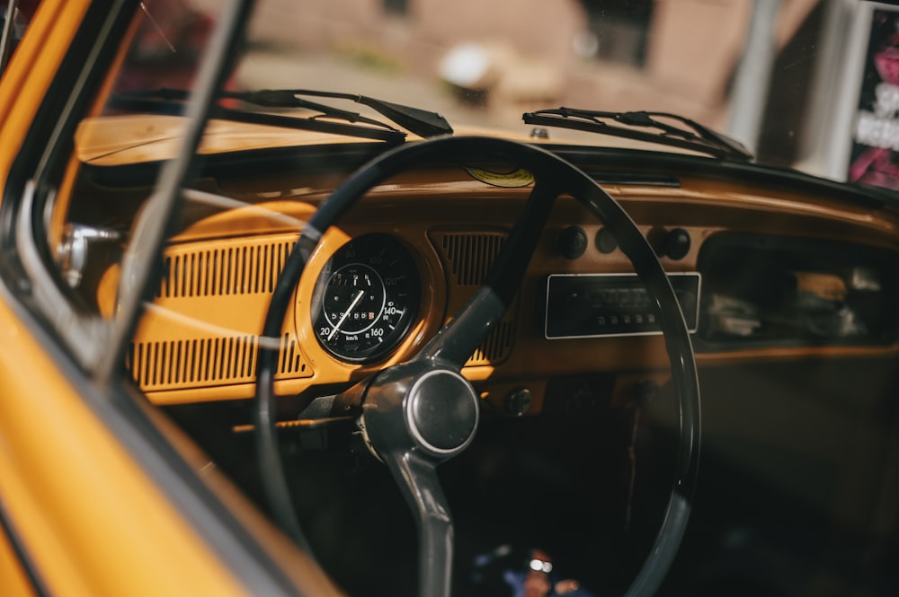 a close up of a steering wheel and dashboard of a car