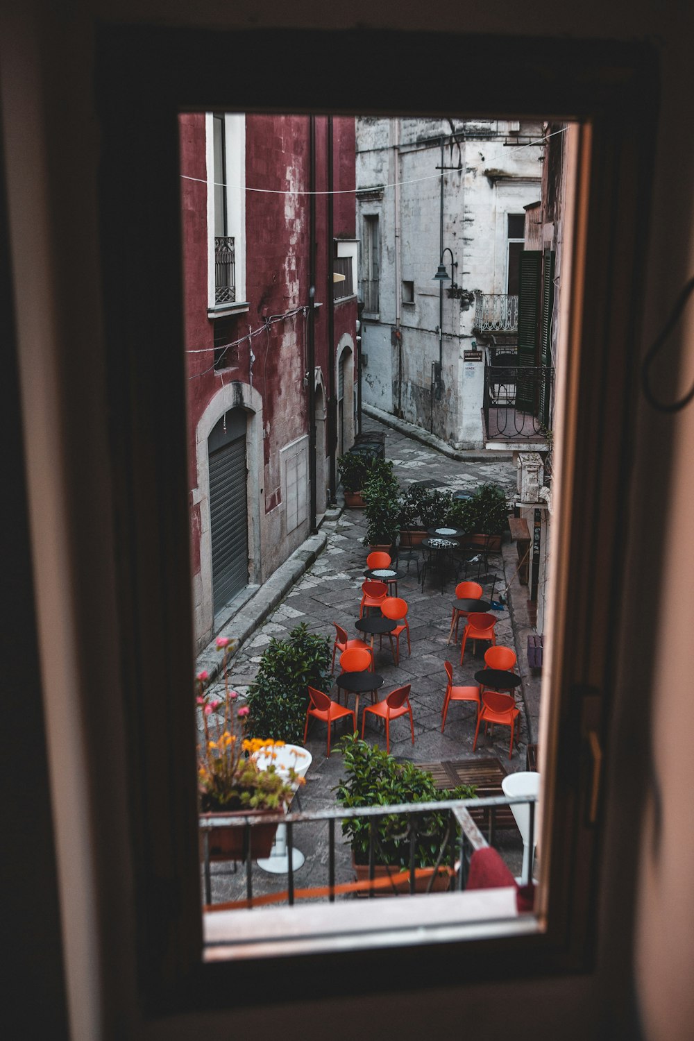 a view of a courtyard through a window