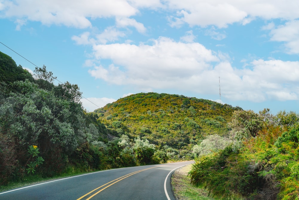 a view of a road with a mountain in the background