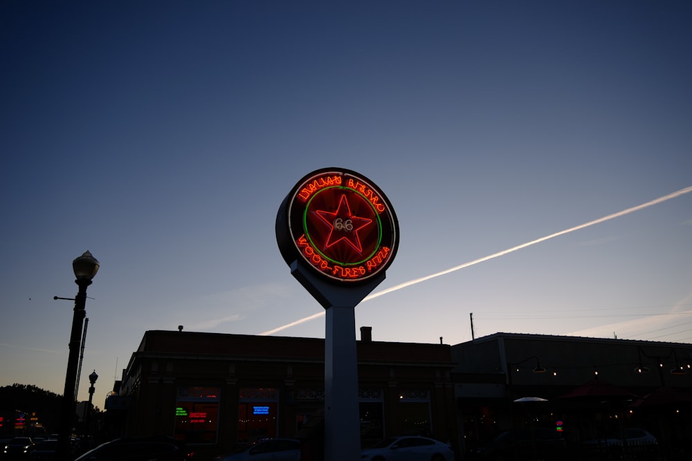 a large sign with a star on it in front of a building
