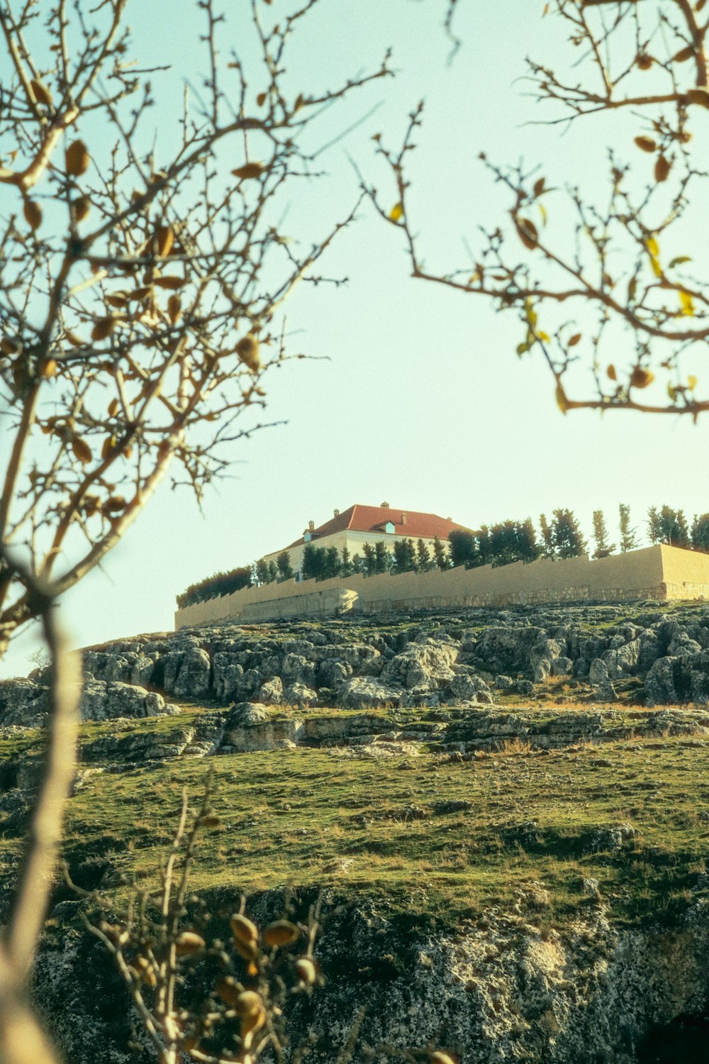 a hill with a building on top of it