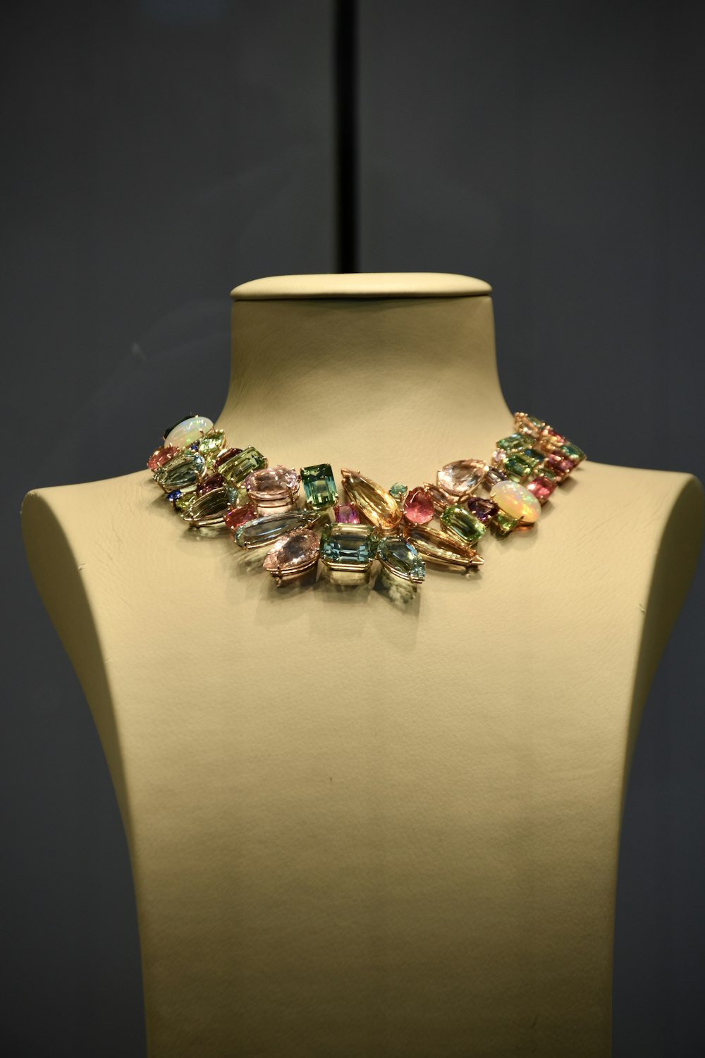 a necklace is displayed on a mannequin