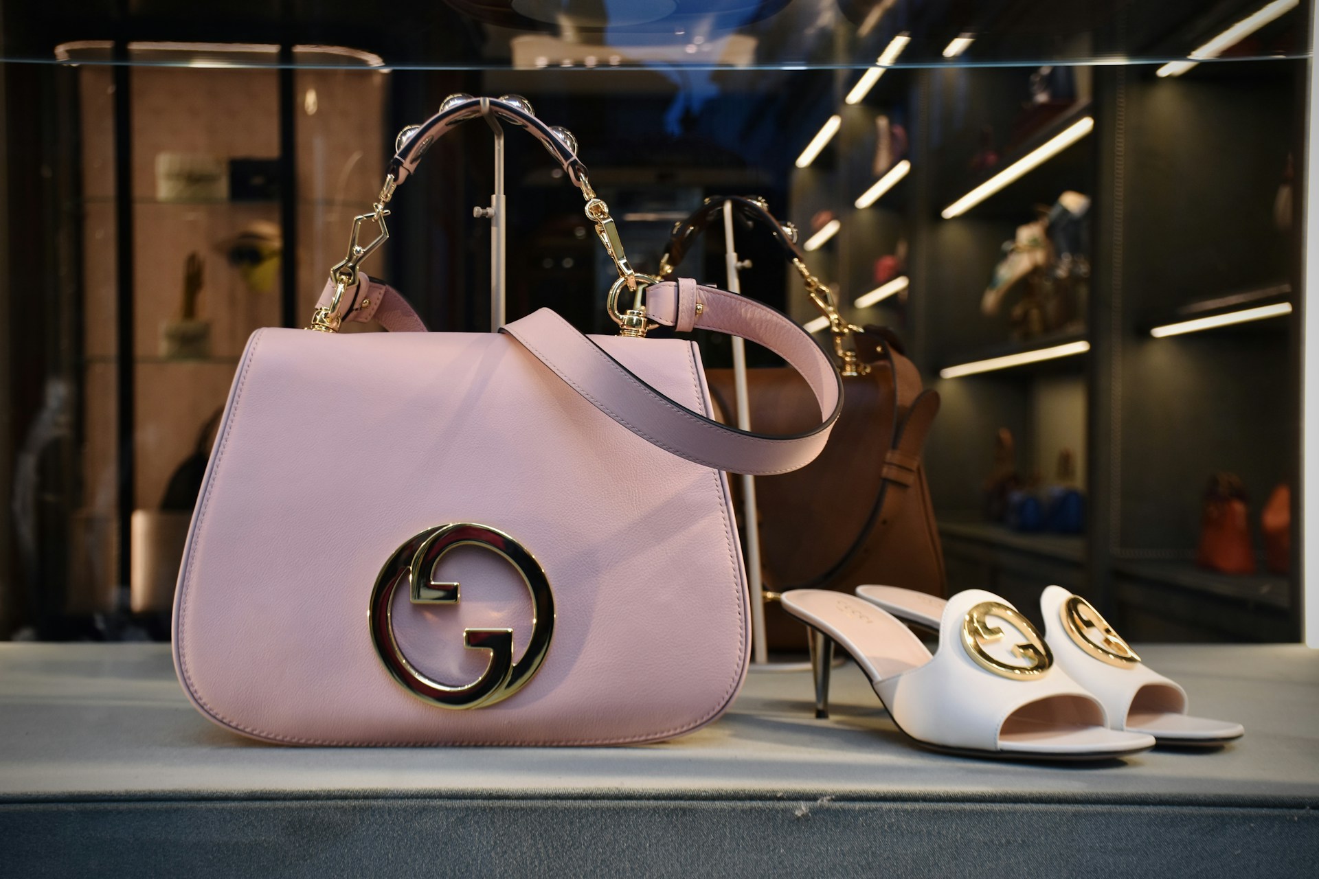 a pair of shoes and a handbag on display