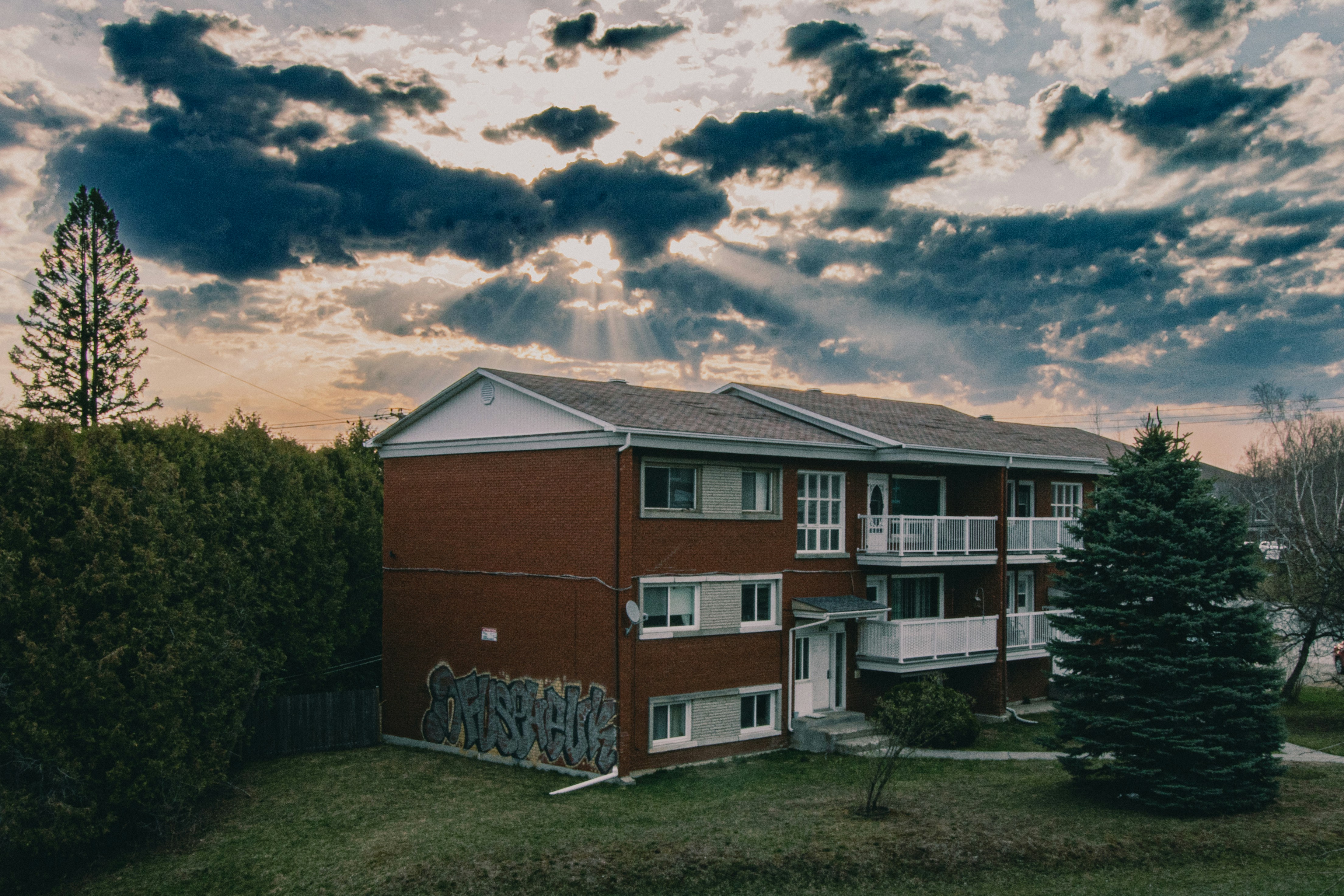 a red building with graffiti on the side of it