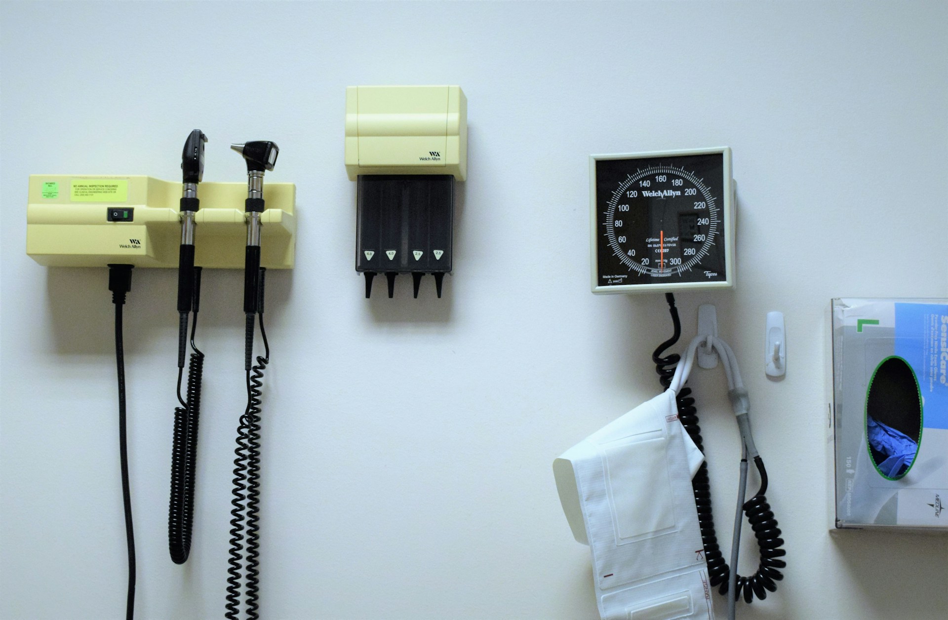 a white wall with a bunch of electrical equipment on it