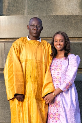 a couple of people standing next to each other