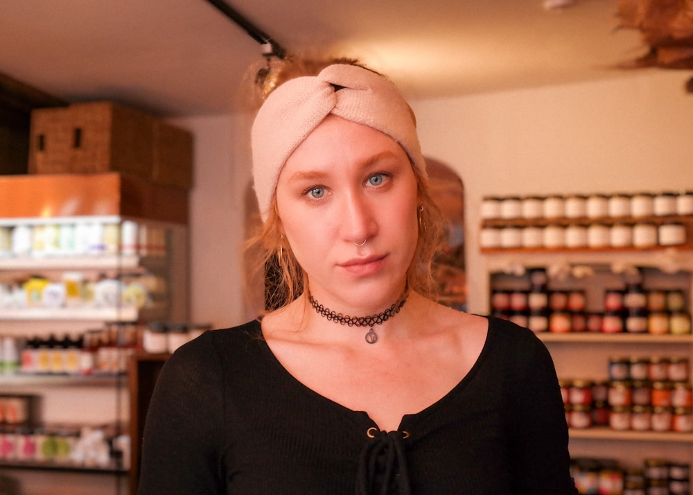 a woman wearing a headband in a store