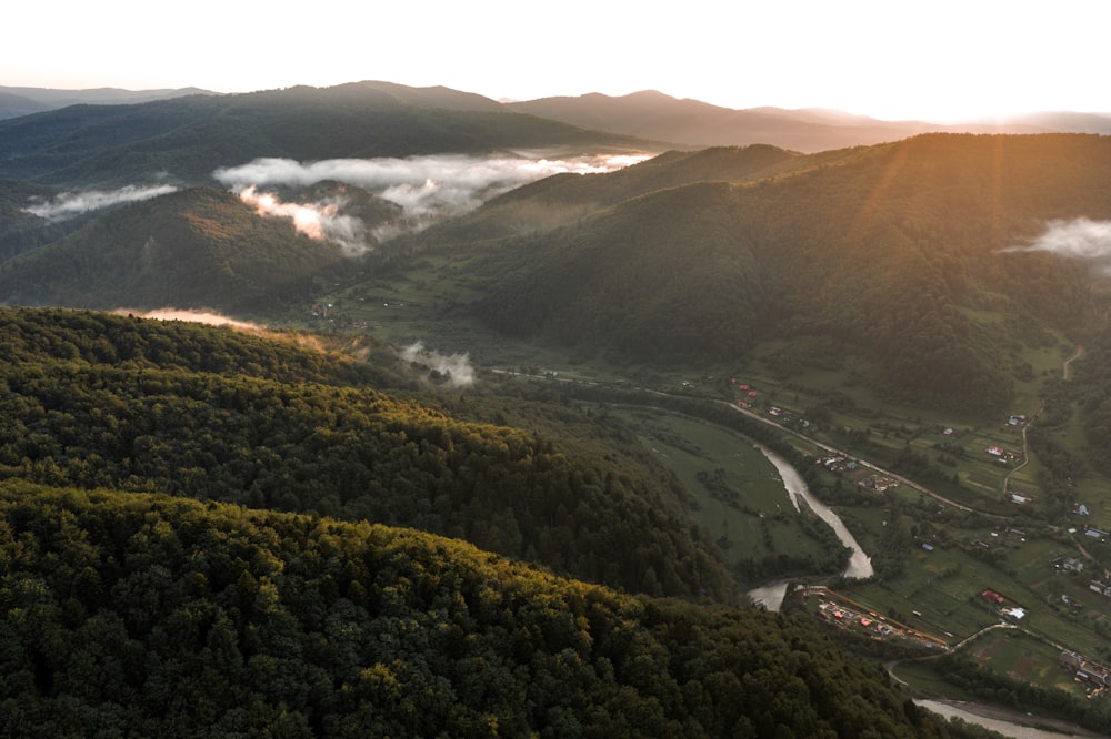 a view of a valley with a river running through it