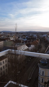 A panoramic view of Jaipur’s Tonk Road showcasing upscale residential buildings.