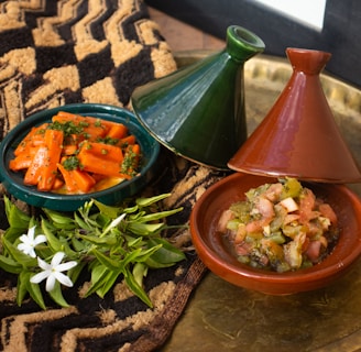 a plate with a bowl of food and a bowl of vegetables