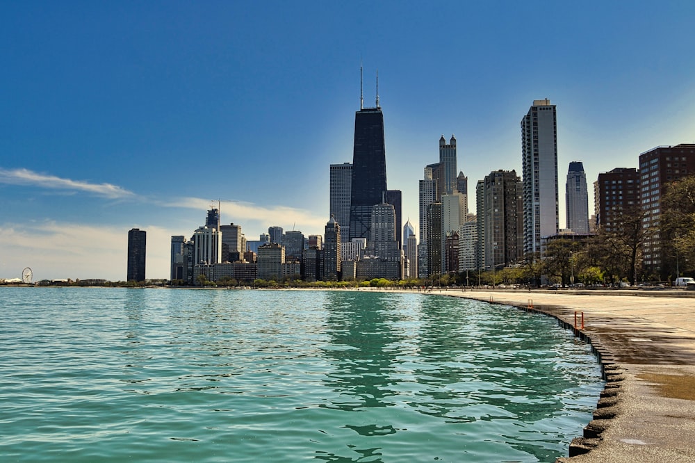 a body of water with a city in the background