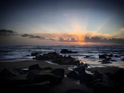 A vibrant sunrise over the rugged coastline of Cape Breton Island, symbolizing new beginnings.
