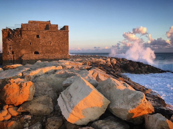Historic Cape Coast Castle bathed in warm afternoon light overlooking the ocean