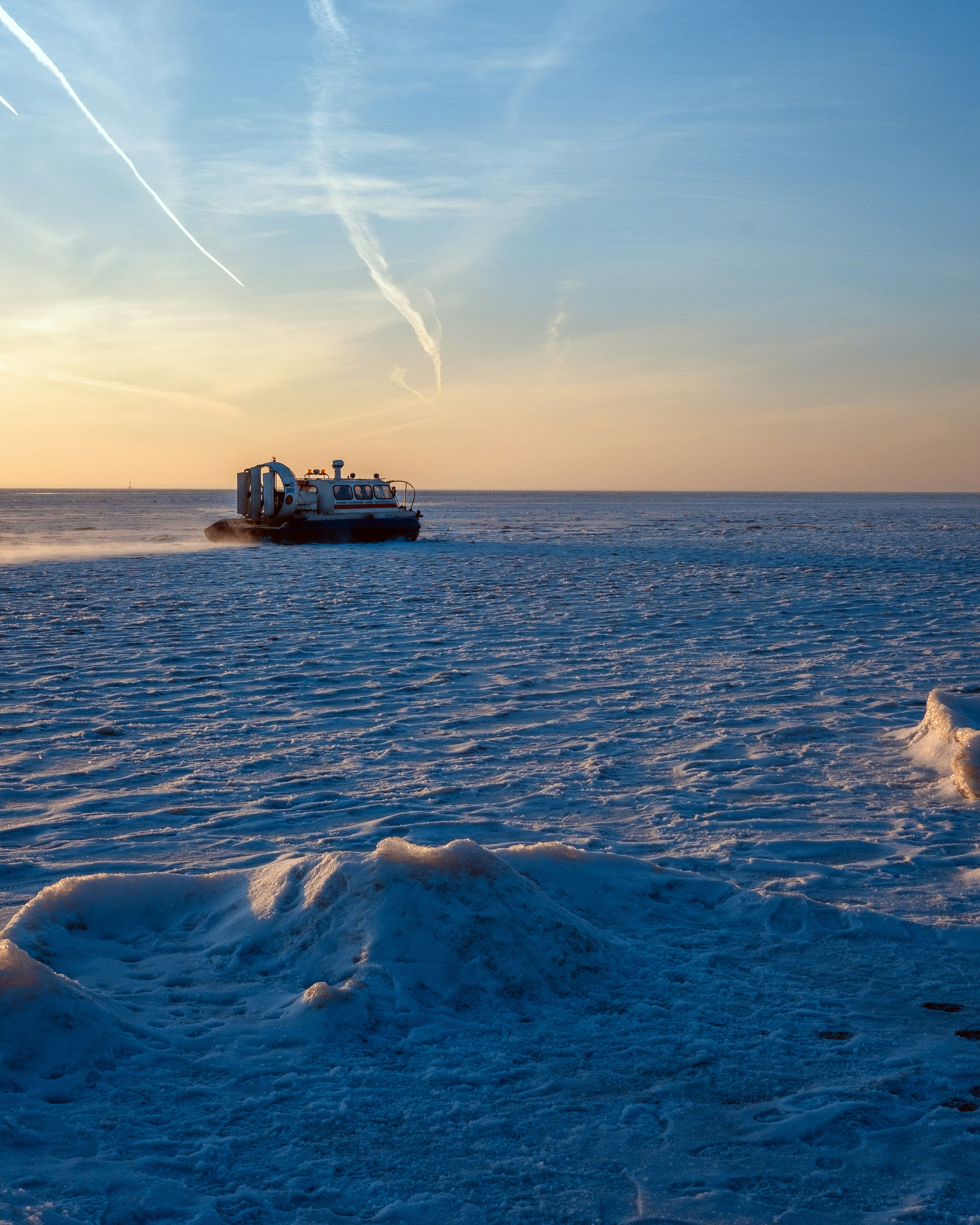 a boat traveling across a large body of water