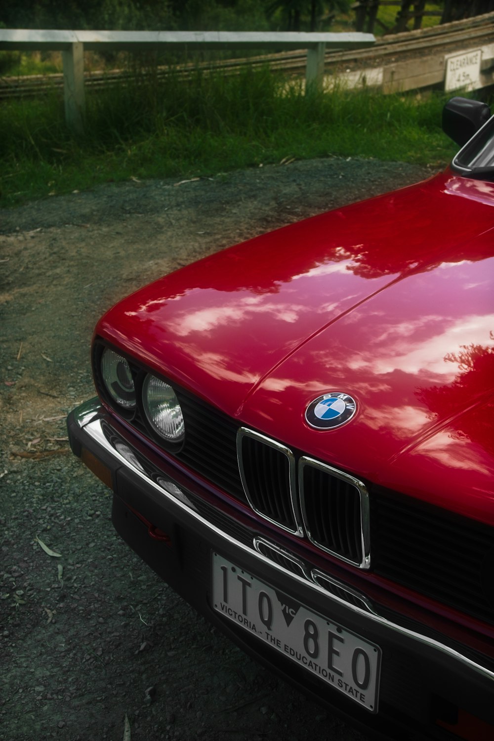 a red car parked on the side of the road