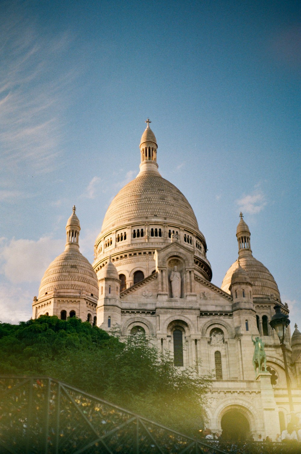 a large white building with two domes on top of it