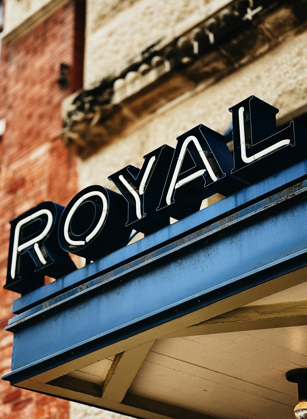 a royal sign on the side of a building