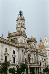 a large building with a clock on the top of it