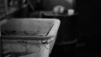 Close-up of a handcrafted ceramic sink with natural textures and soft curves.