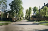Quiet suburban street lined with trees and well-kept homes