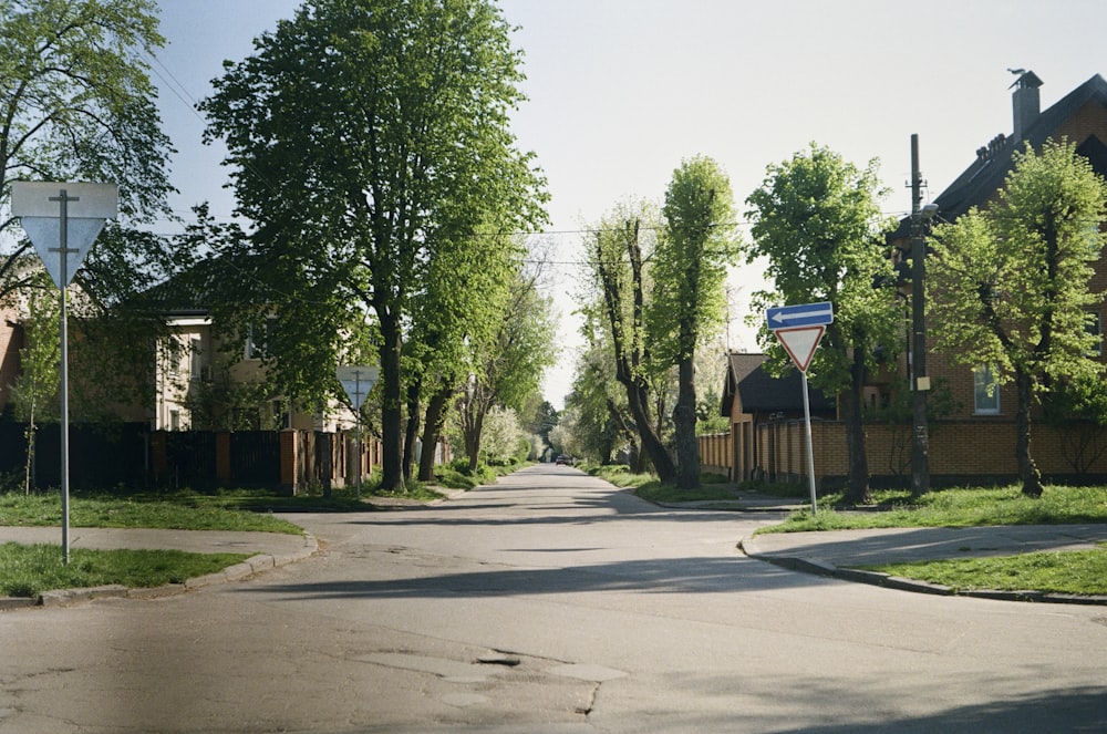 a street with houses and trees on both sides