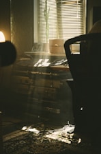 a room with a table and a lamp in it
