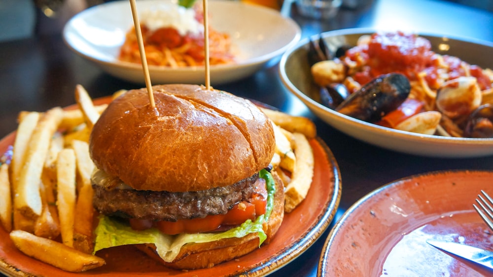 a hamburger and french fries on a plate