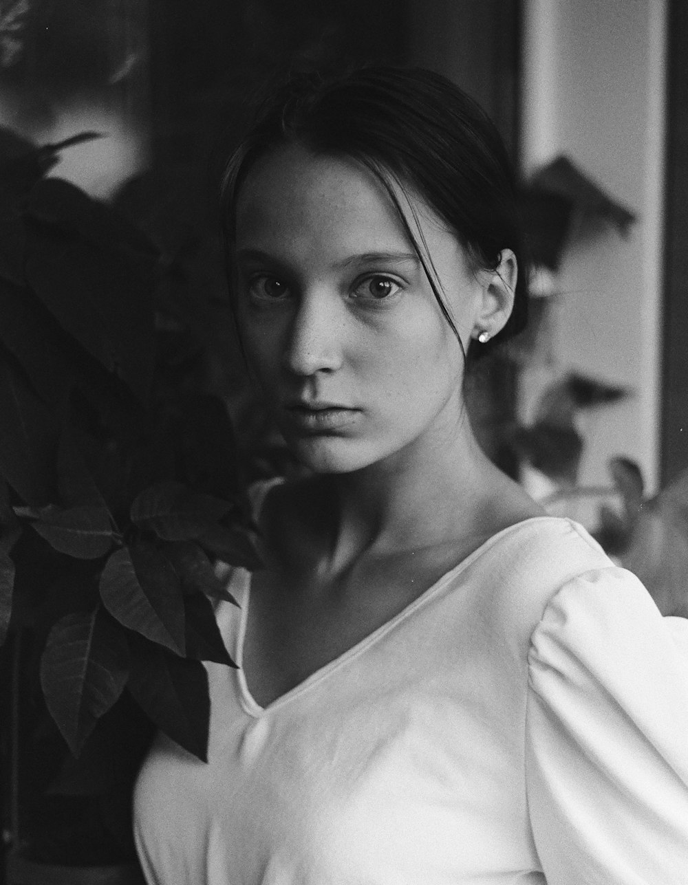 a black and white photo of a young woman