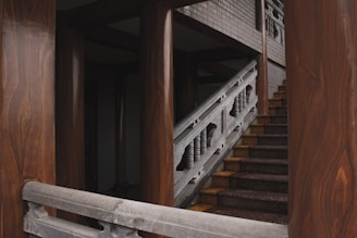 A stylish staircase featuring wooden railings and steps.