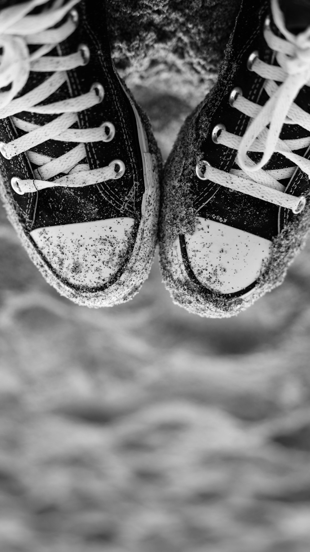 a pair of black and white tennis shoes