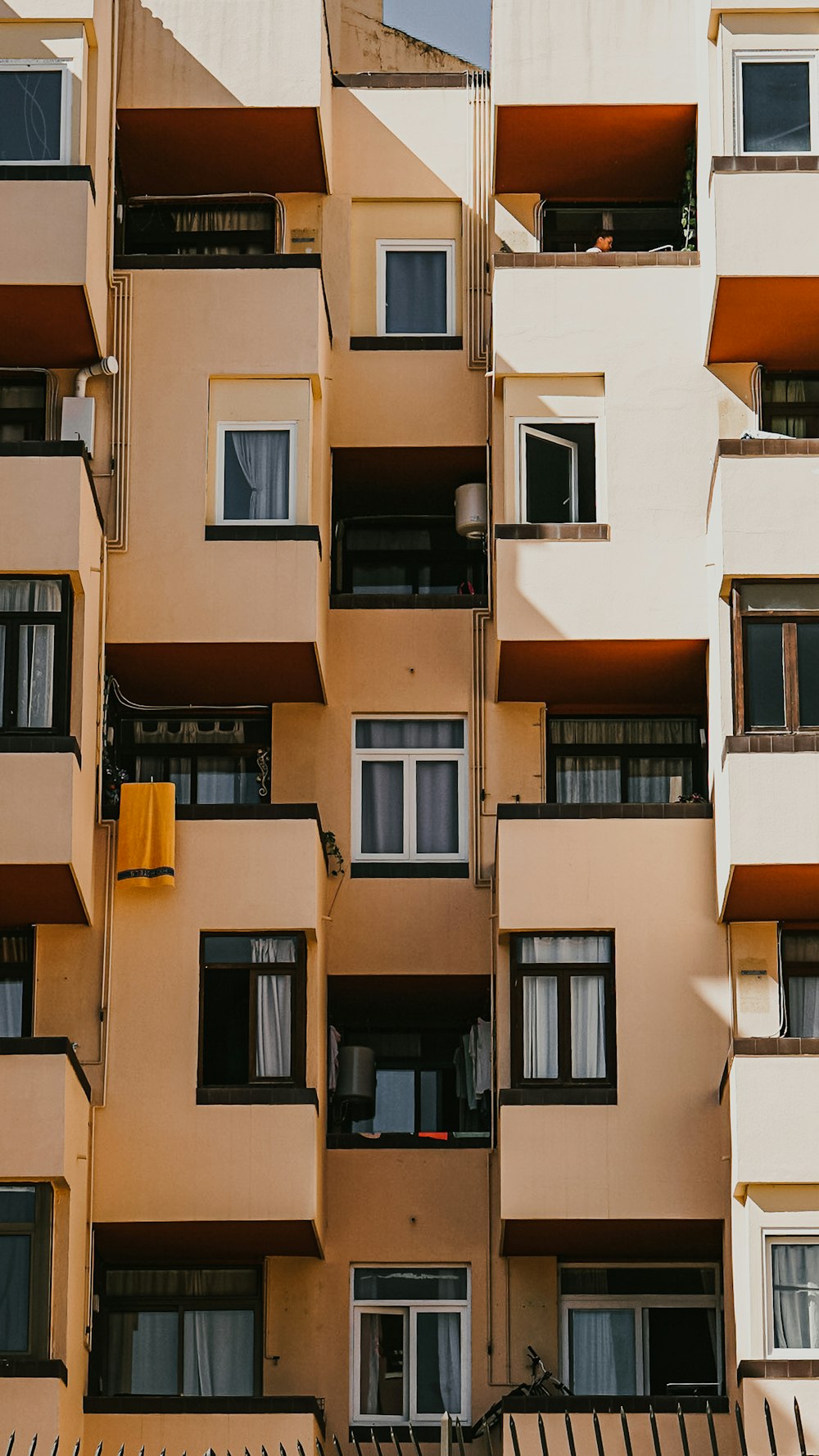 a tall building with balconies and balconies on each floor