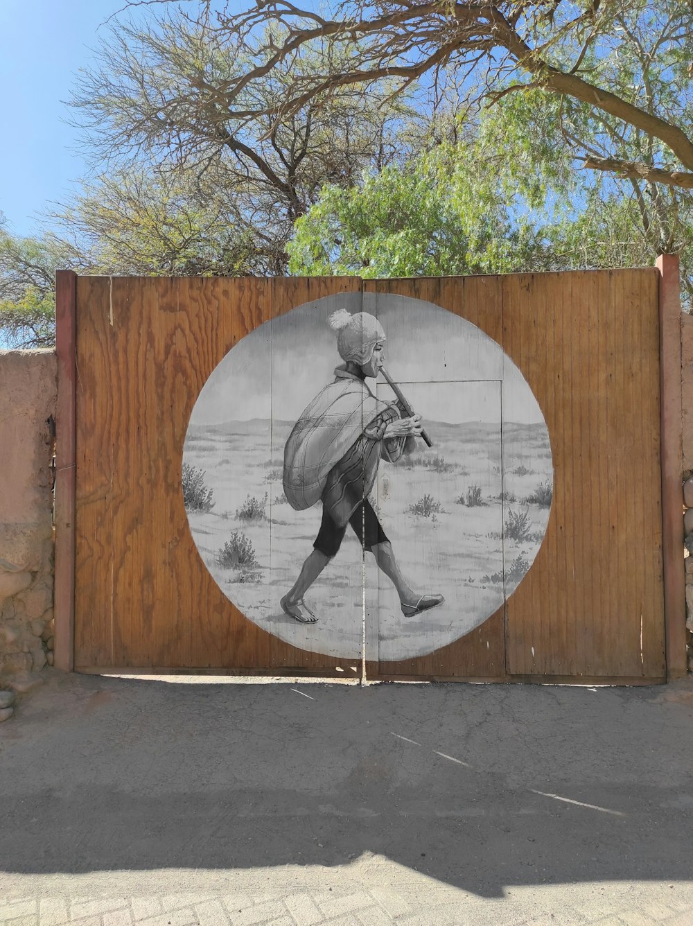 a mural of a man carrying a large bag