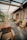 A scenic outdoor setting featuring wooden furniture treated with tar.
