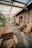 A scenic outdoor setting featuring wooden furniture treated with tar.