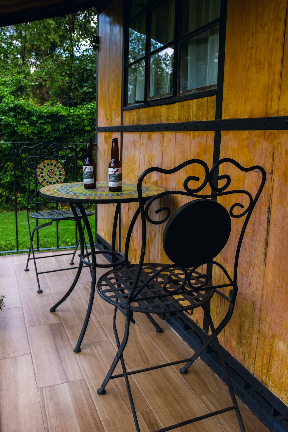 a patio with a table and chairs on it