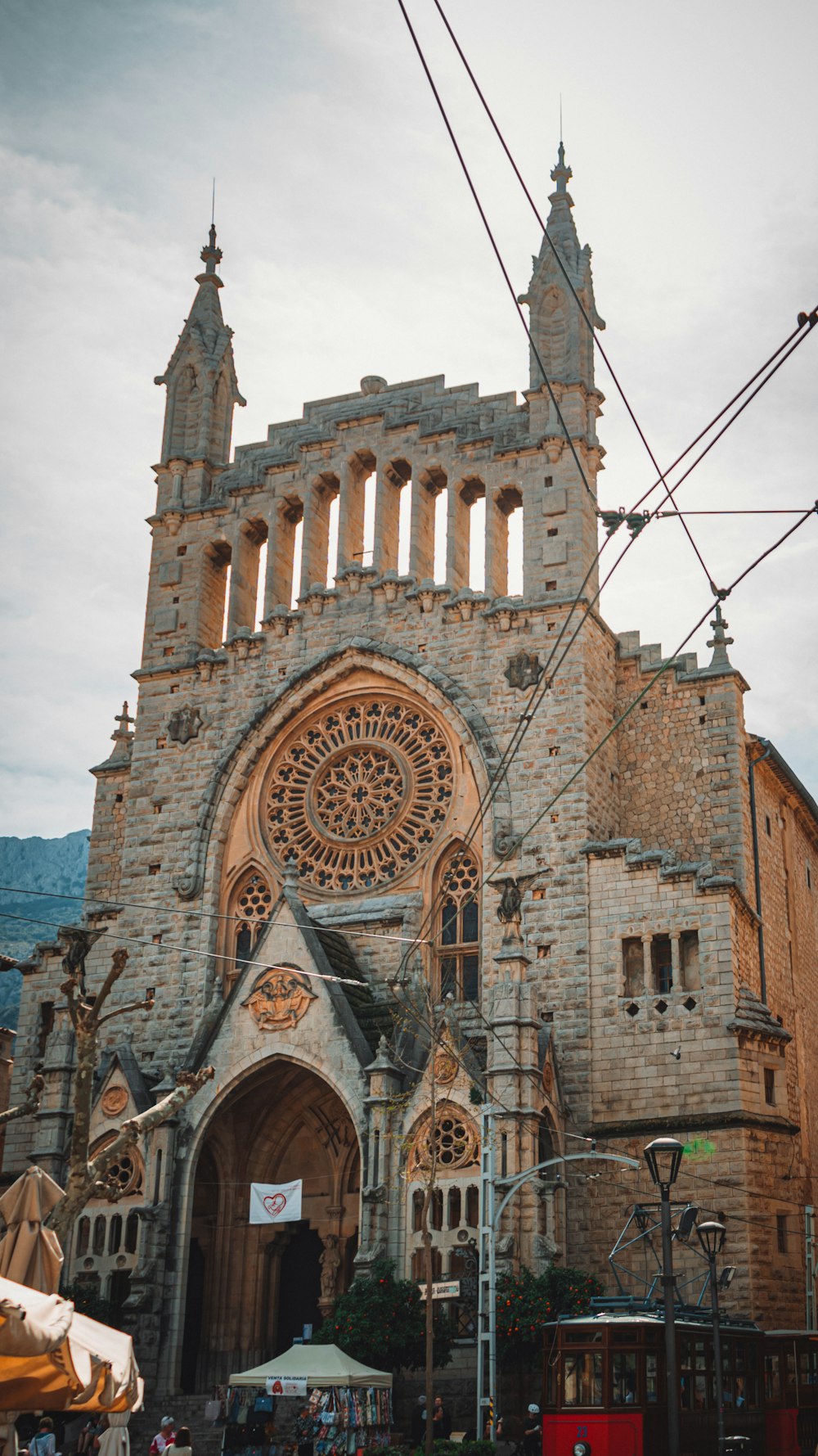 a large stone church with a clock on the front