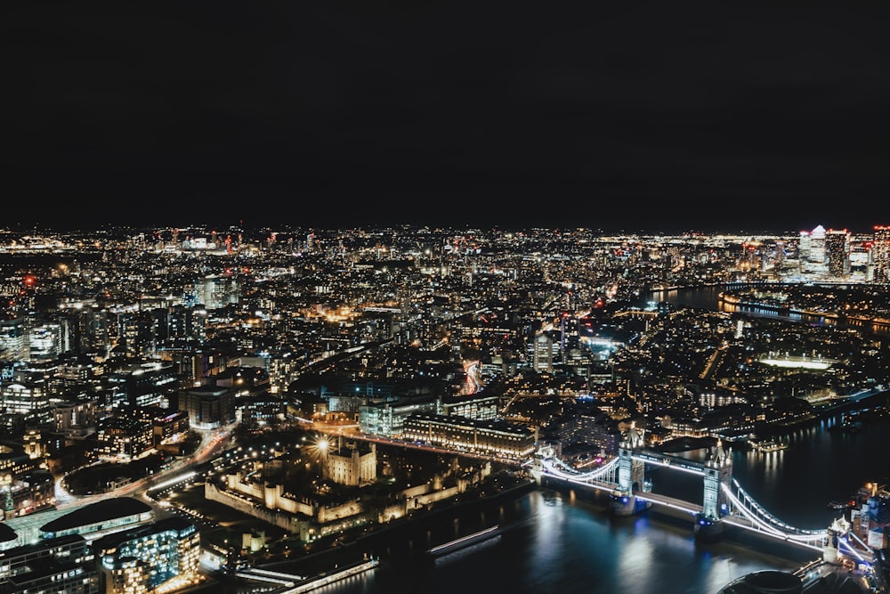 a night view of a city and a bridge